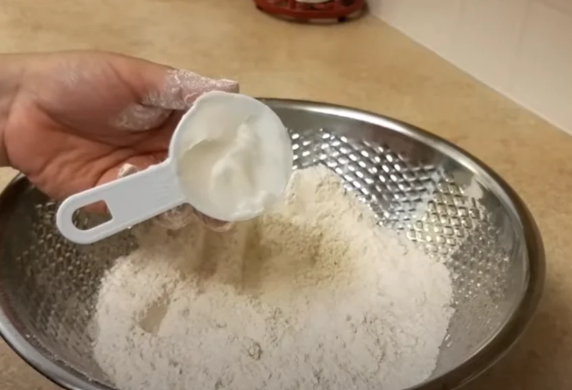 Adding all ingredients to tortilla flour